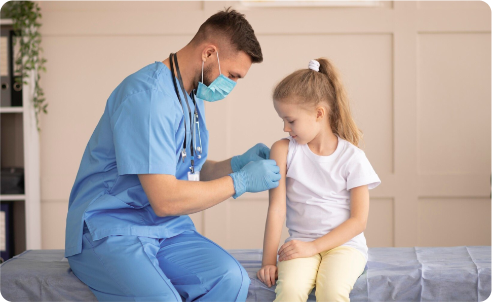 A healthcare professional administering drugs to a child